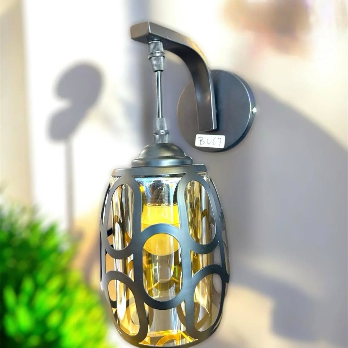 Modern Black Metal Cage Wall Light with Amber Glass Shade