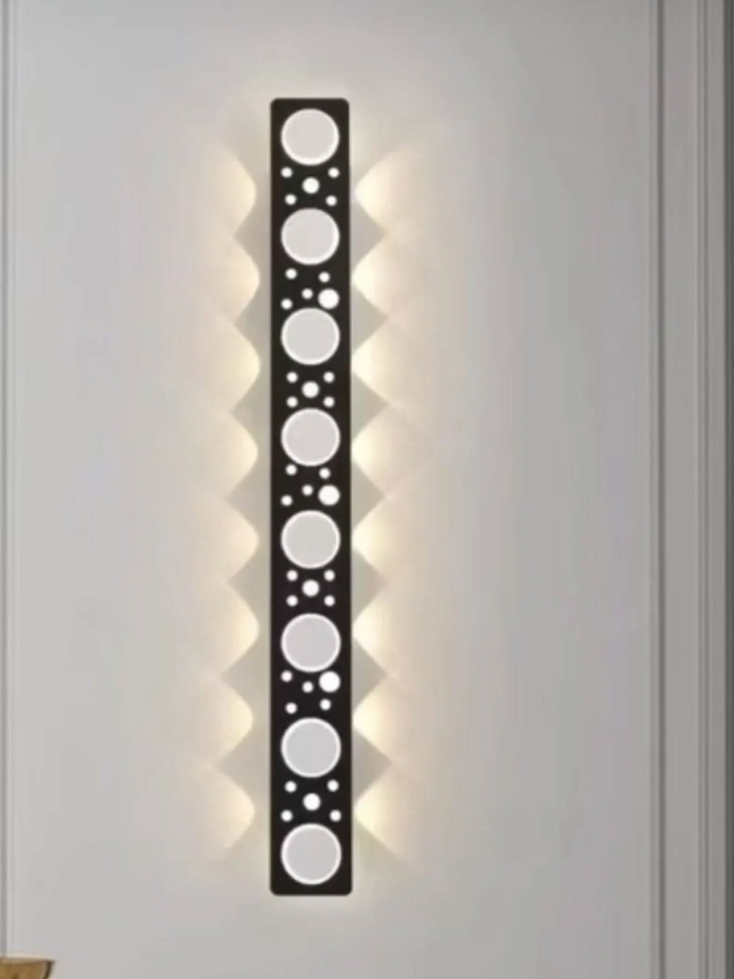 Modern Black Geometric Wall Light with Circular Cutouts