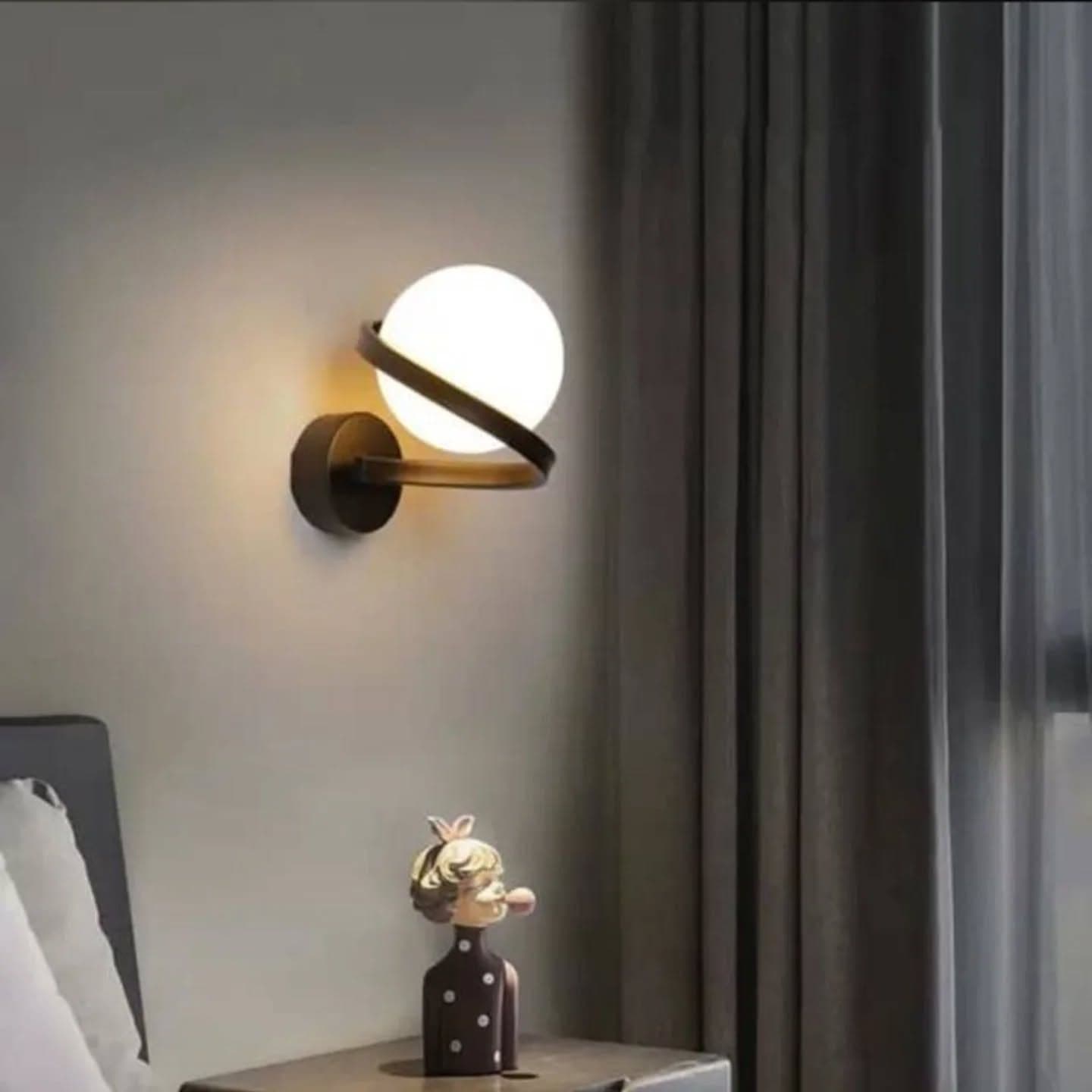 Modern Black Metal Globe Wall Light with Curved Arm