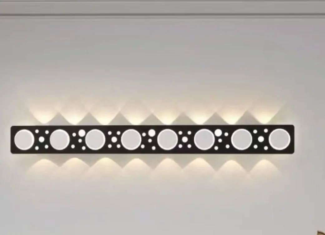 Modern Black and White LED Wall Light with Circular Cutouts