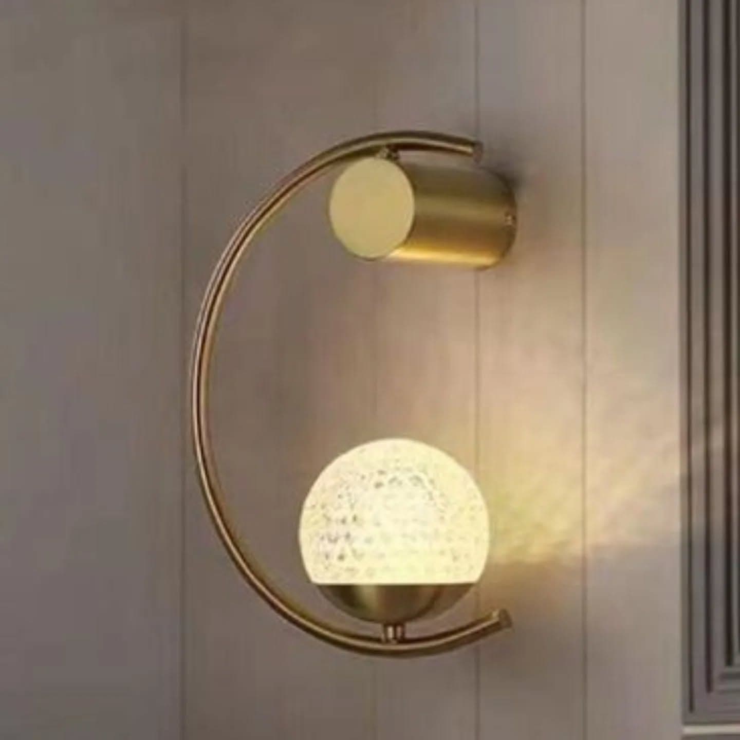 Modern Gold Brass Globe Wall Light with Textured Glass
