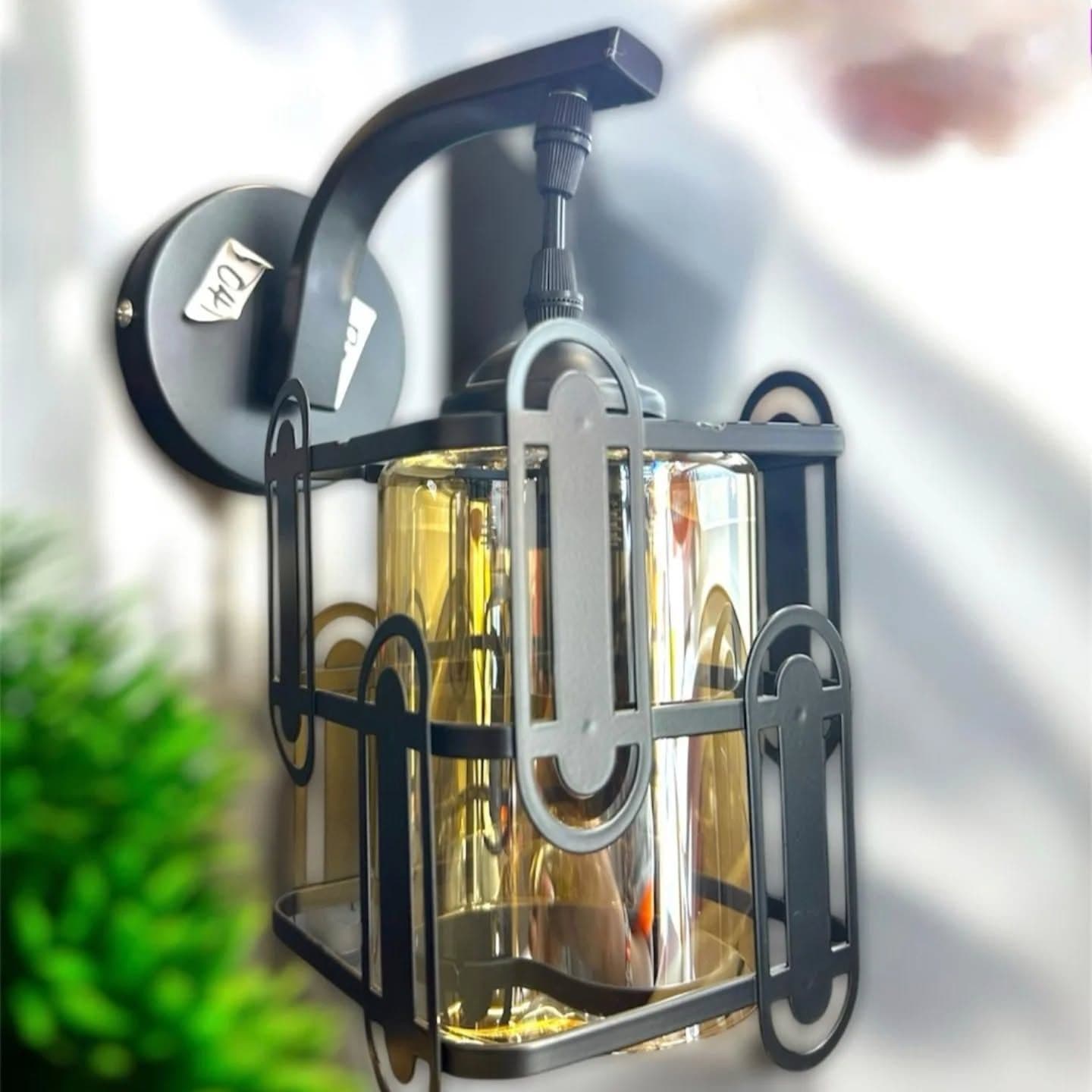 Industrial Matte Black Cage Wall Light with Amber Glass Shade