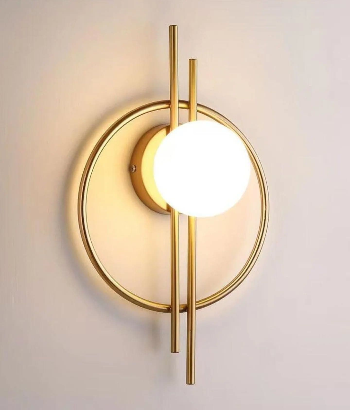 Modern Gold Circular Wall Light with Glowing Orb