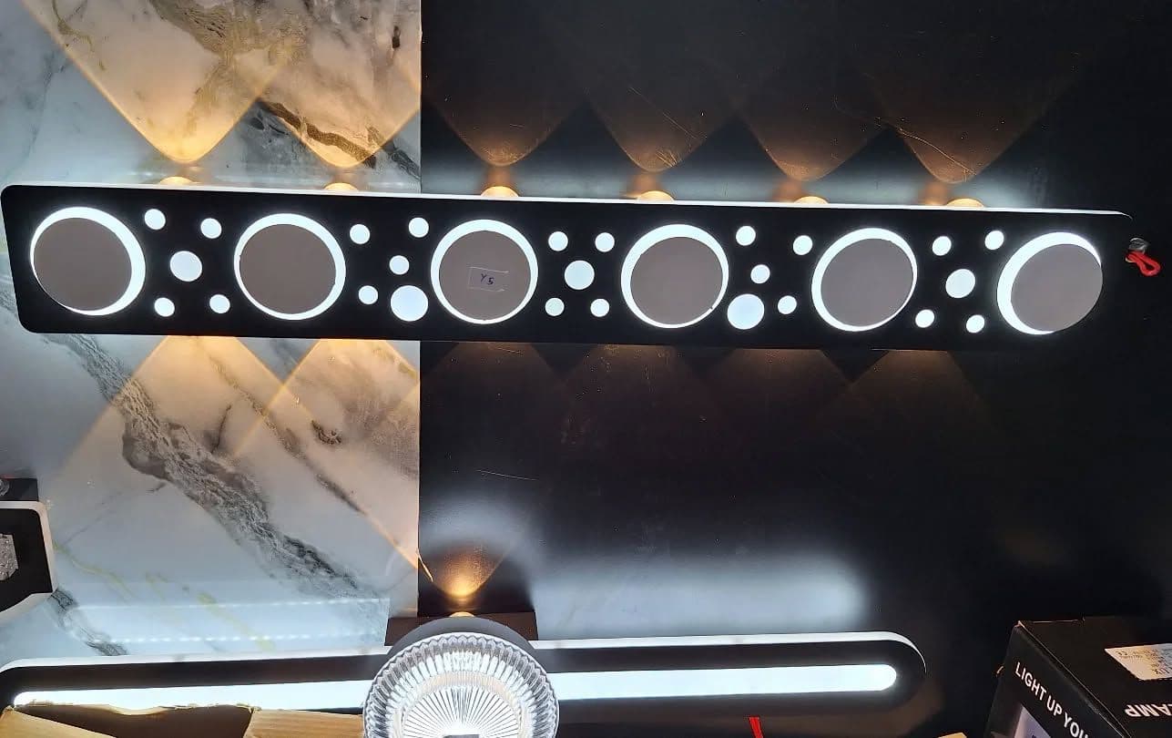 Modern Black & White LED Wall Light with Circular Cutouts