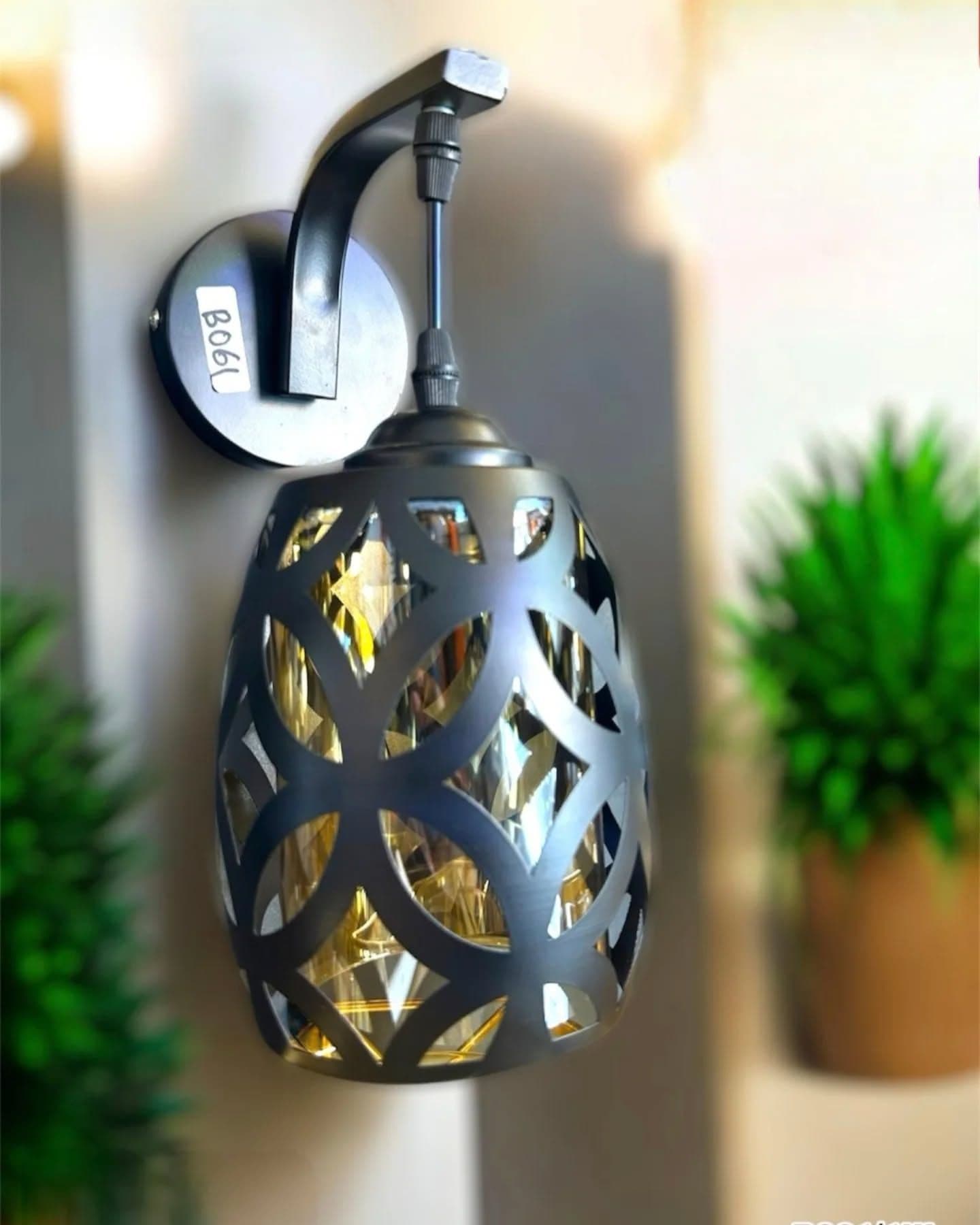 Modern Matte Black and Gold Cut-Out Wall Light with Amber Glass Shade