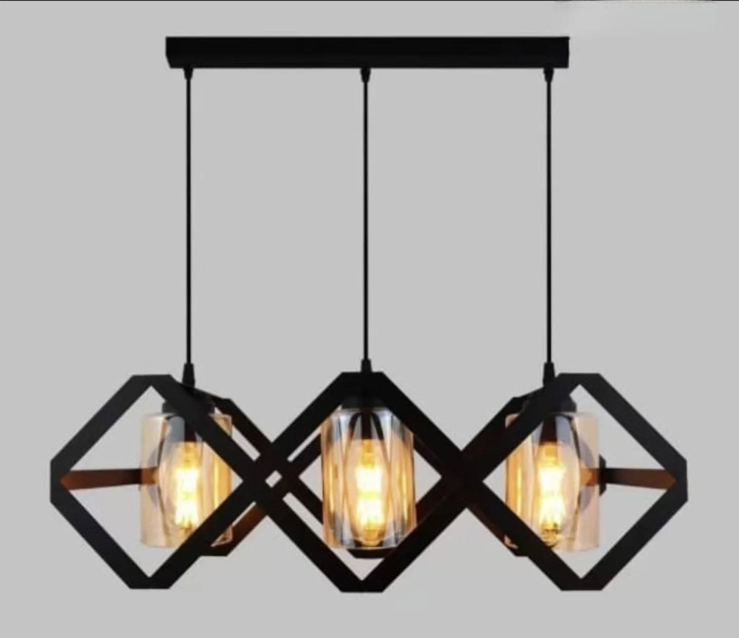 Industrial Black Three-Light Pendant with Amber Glass Shade